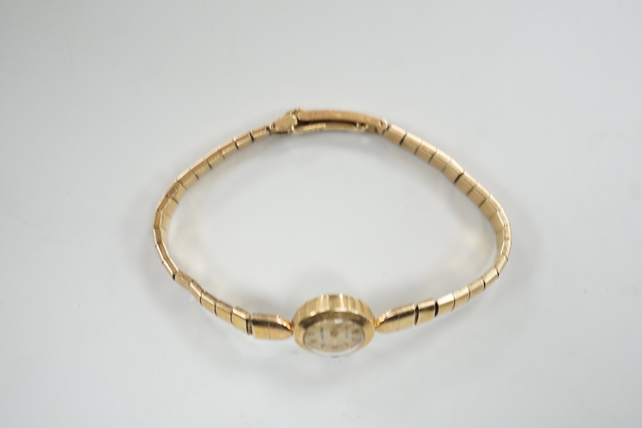A lady's 9ct gold Rolex Precision manual wind wrist watch, on 9ct gold Rolex bracelet, case diameter 16mm, gross weight 16.8 grams, with Rolex box.